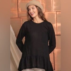 Boutique Black waffle knit ruffle hem tunic top, comparison to free people.